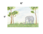 A watercolor-style art print showing an elephant standing in a grassy landscape with trees and a small bird, with size labels '12"' at the top and '9"' on the left over a white background.