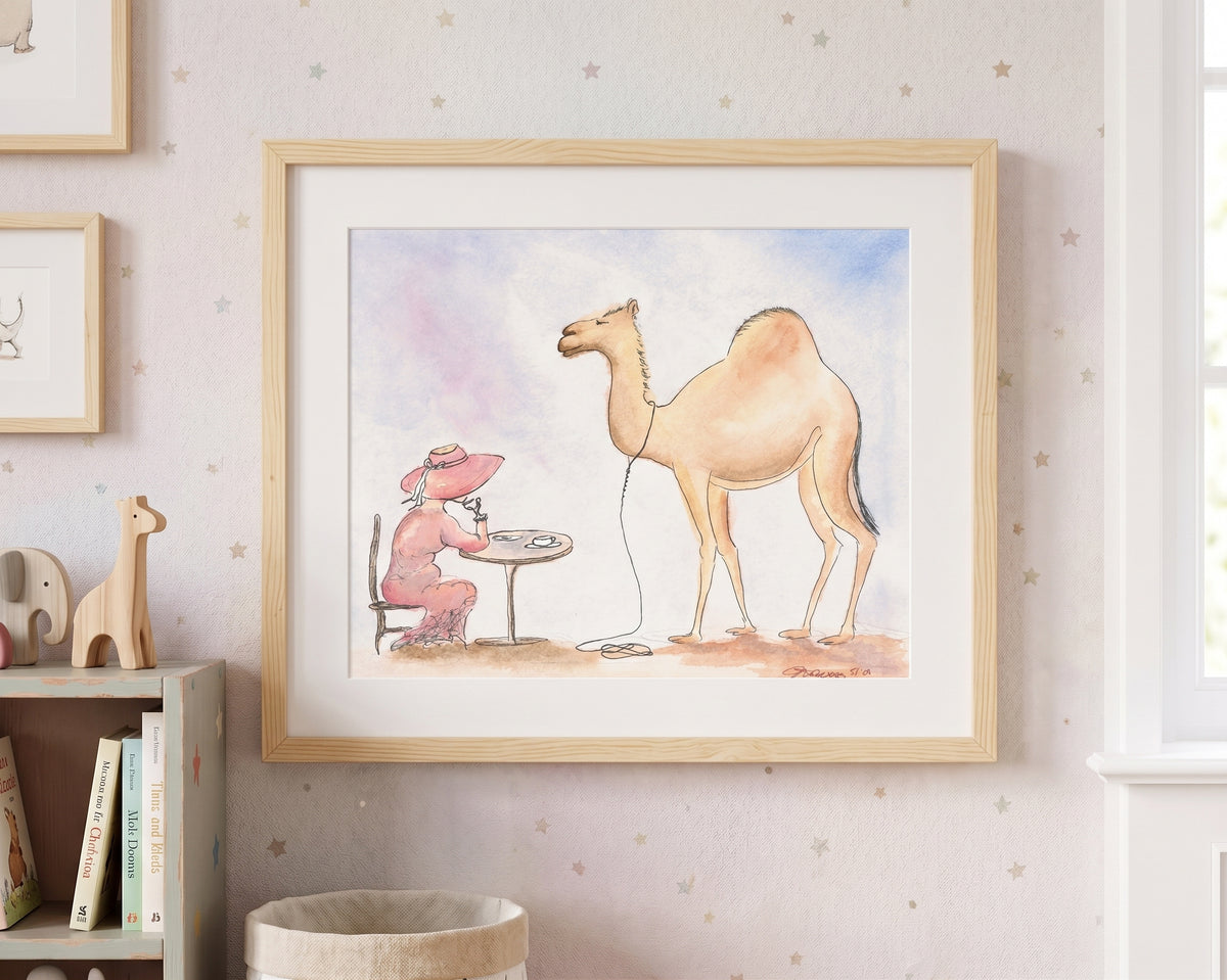 A framed watercolor art print hanging on a light pink star-patterned wallpaper wall. The print features a whimsical illustration of a camel standing next to a woman sewing at a table.